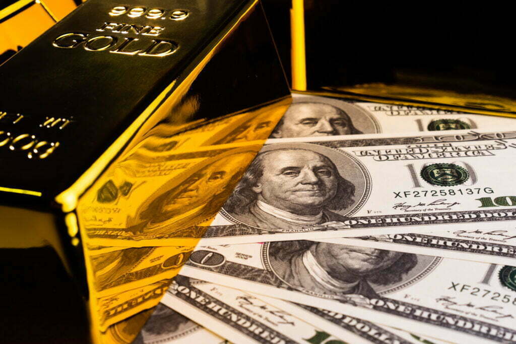 Close up of Gold bars and banknotes. financial concept